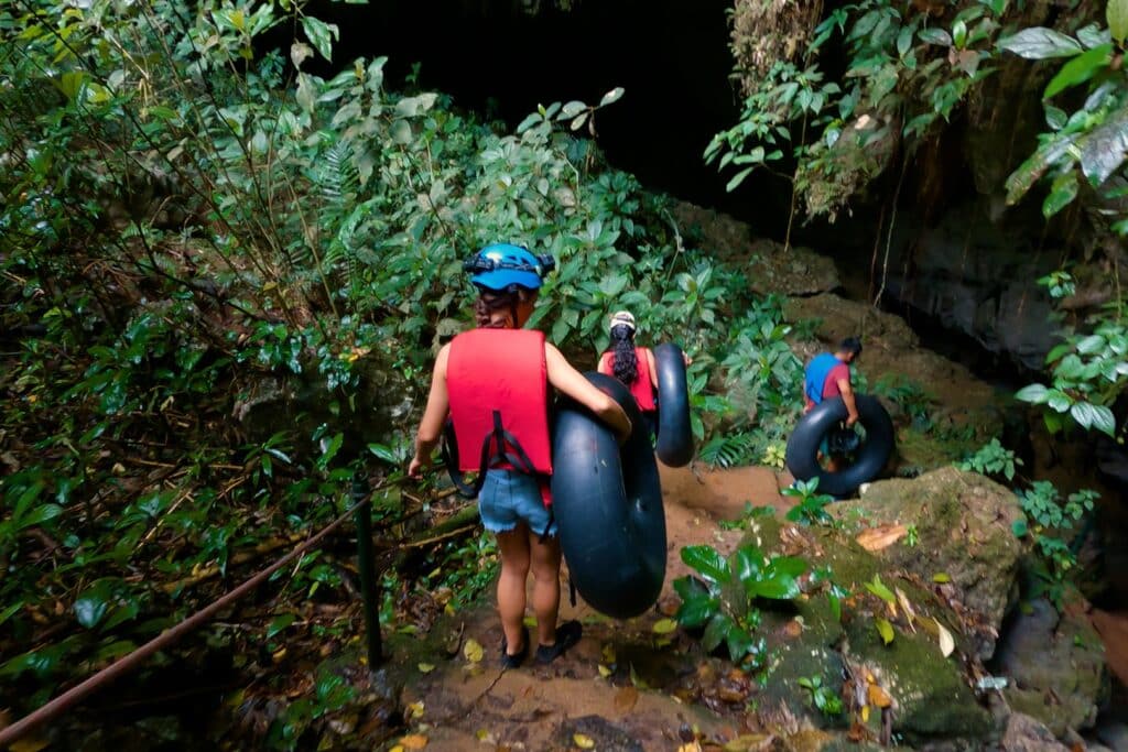 A group of guests walking into St. Herman's Cave